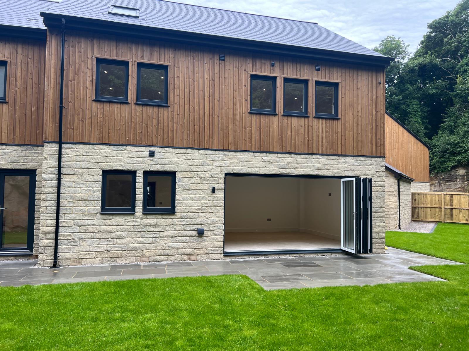 Anthracite windows on a modern extension supplied by WGS Glazing