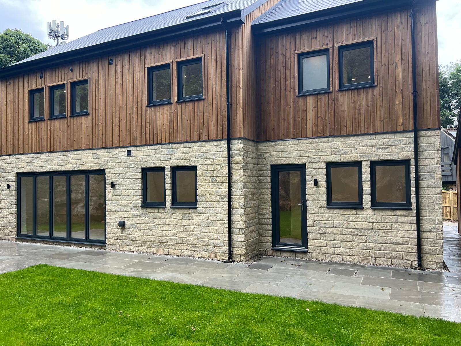 Anthracite PVCu windows on a modern extension, supplied by WGS Glazing