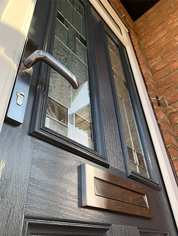 Composite door detail with handle, letterbox and letterbox surround, supplied by WGS Glazing