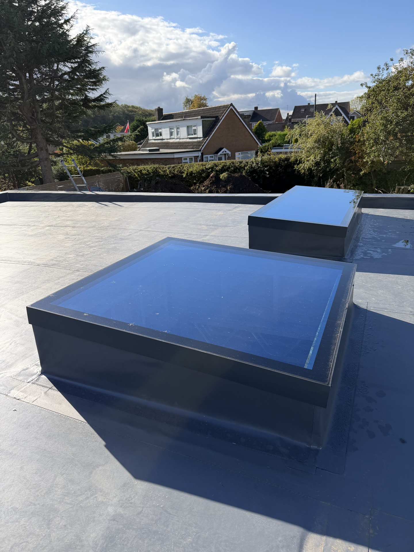 Anthracite framed flat rooflight over a kitchen, supplied by WGS Glazing